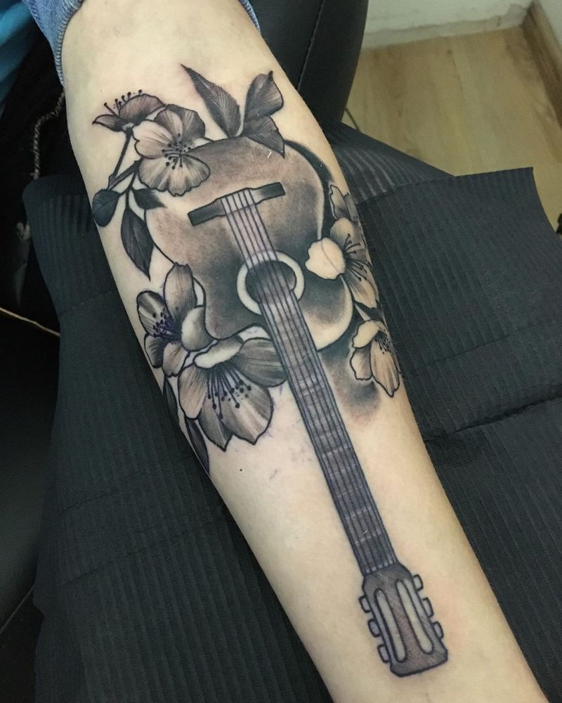 30 Pretty Guitar Tattoos for Your Inspiration