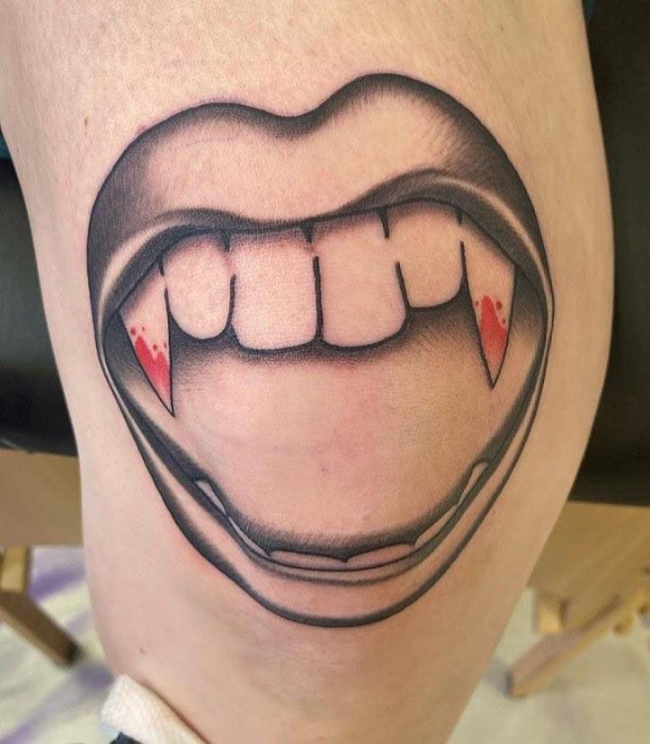 30 Unique Vampire Fang Tattoos You Can't Miss