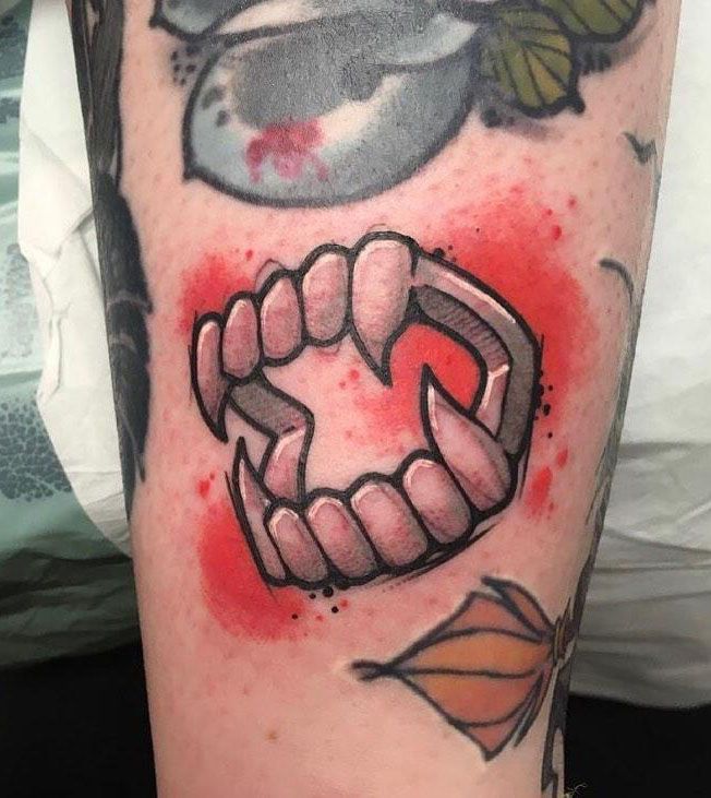 30 Unique Vampire Fang Tattoos You Can't Miss