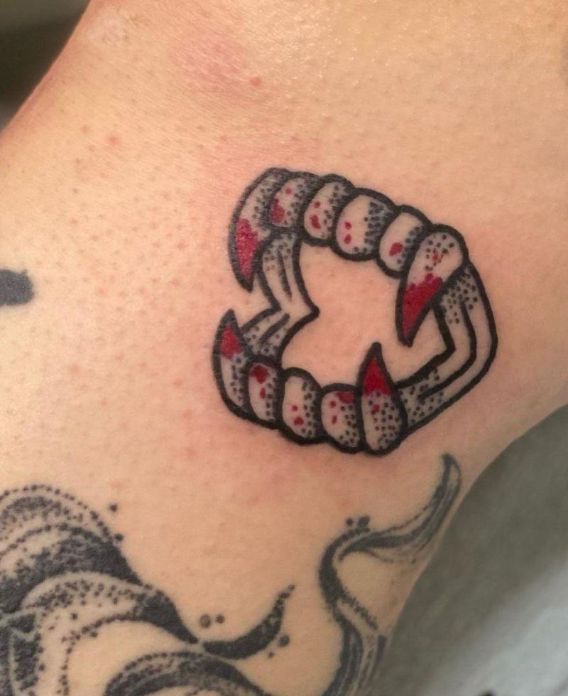 30 Unique Vampire Fang Tattoos You Can't Miss