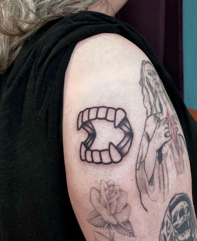 30 Unique Vampire Fang Tattoos You Can't Miss