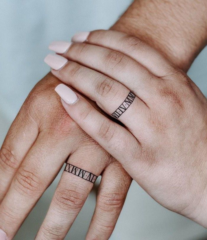 Roman numeral discount wedding band tattoo