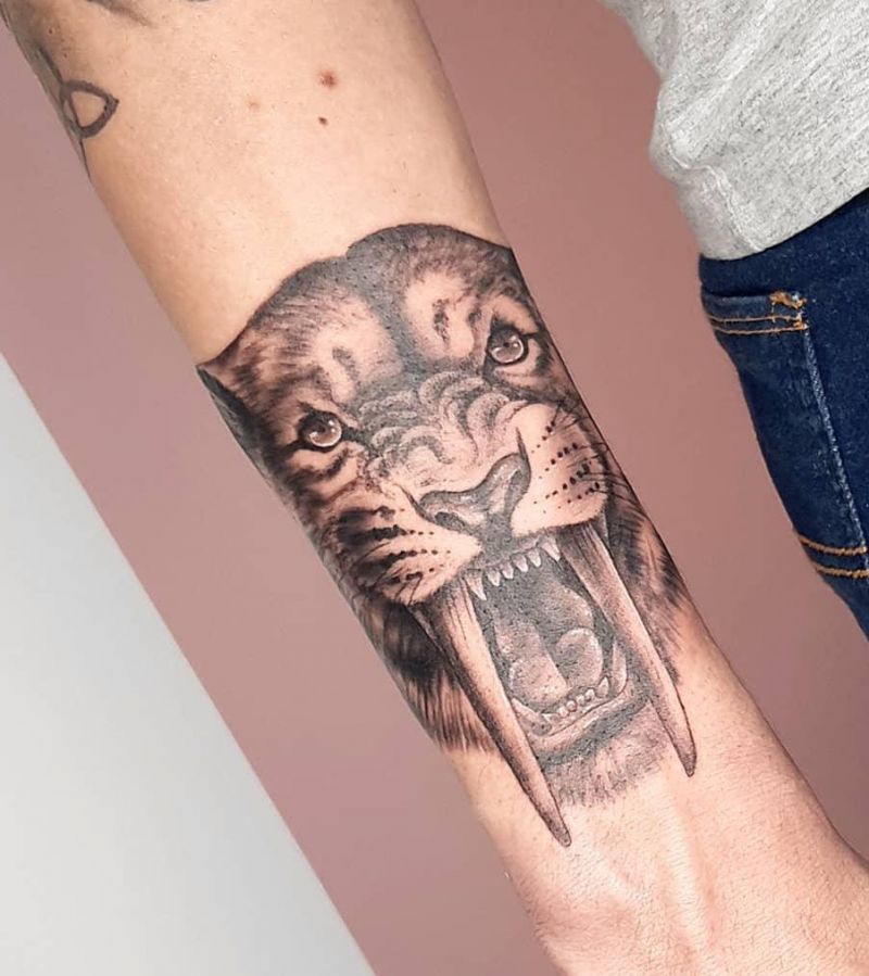 30 Unique Saber Tooth Tiger Tattoos Make You Attractive