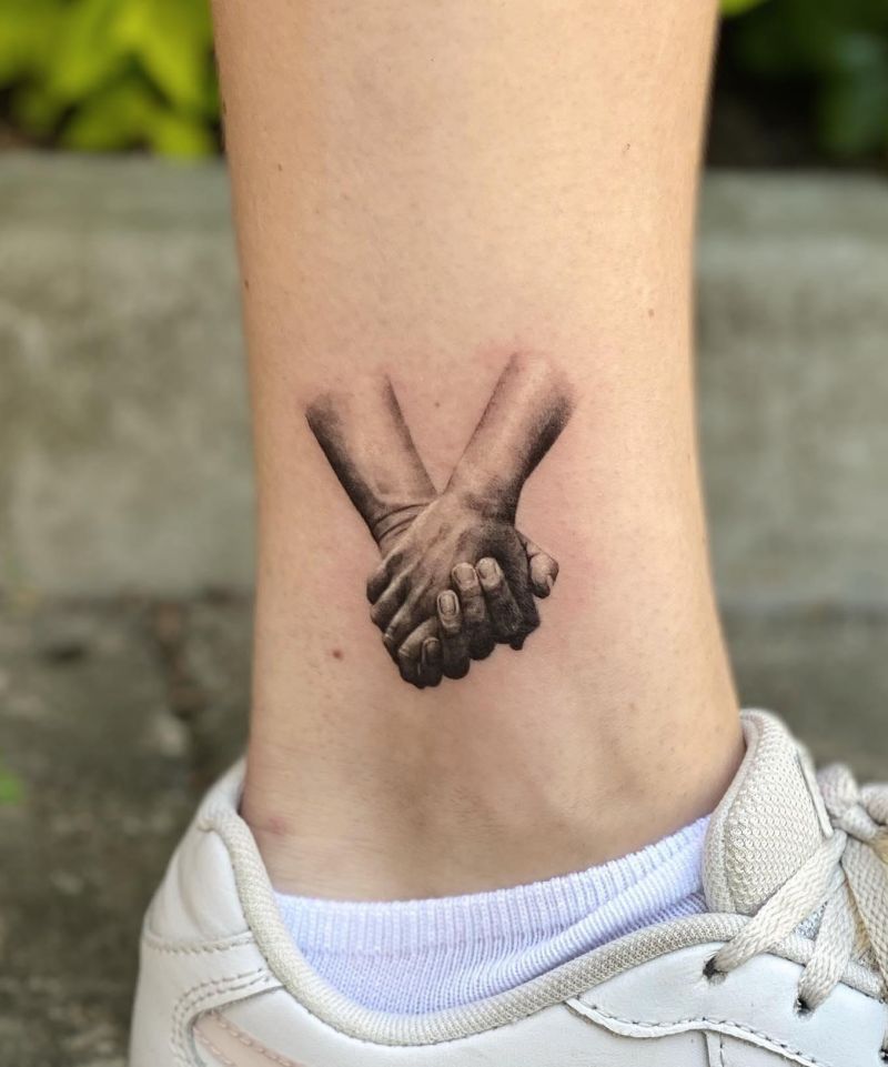 30 Great Holding Hands Tattoos You Will Love