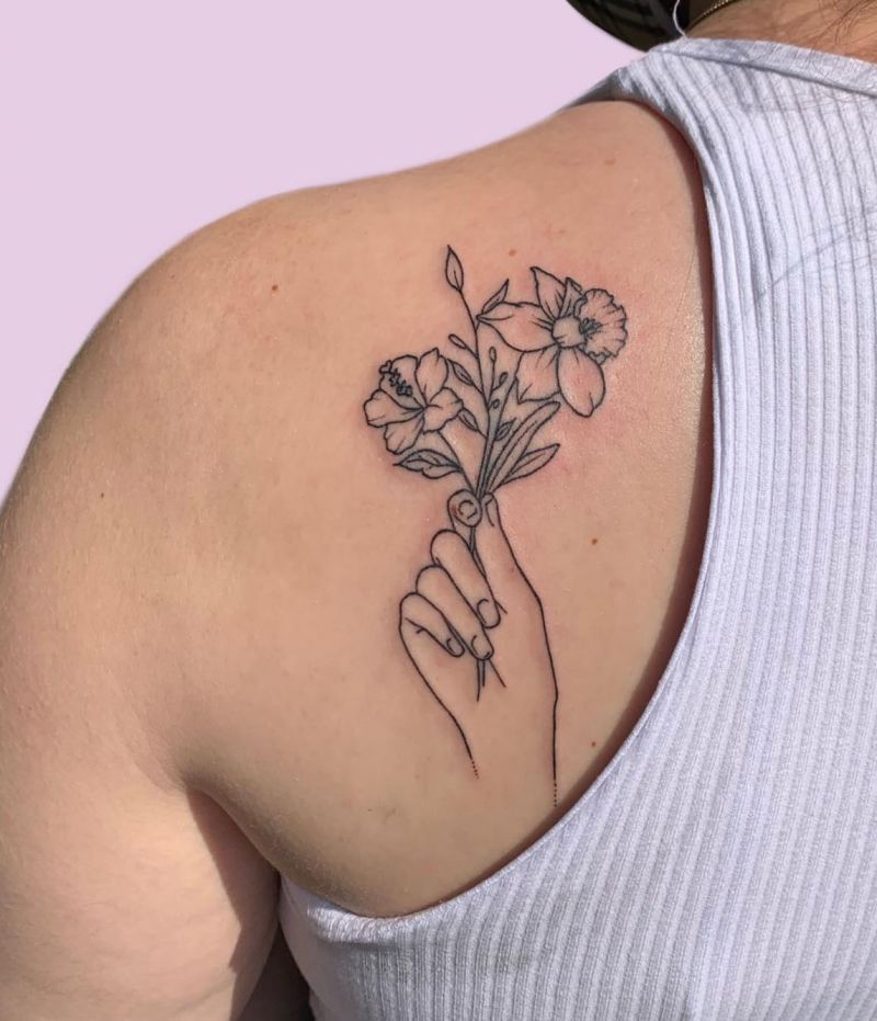 30 Great Hand Holding Flowers Tattoos Make You Attractive