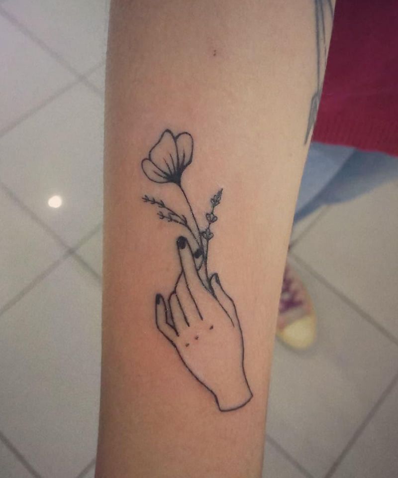 30 Great Hand Holding Flowers Tattoos Make You Attractive