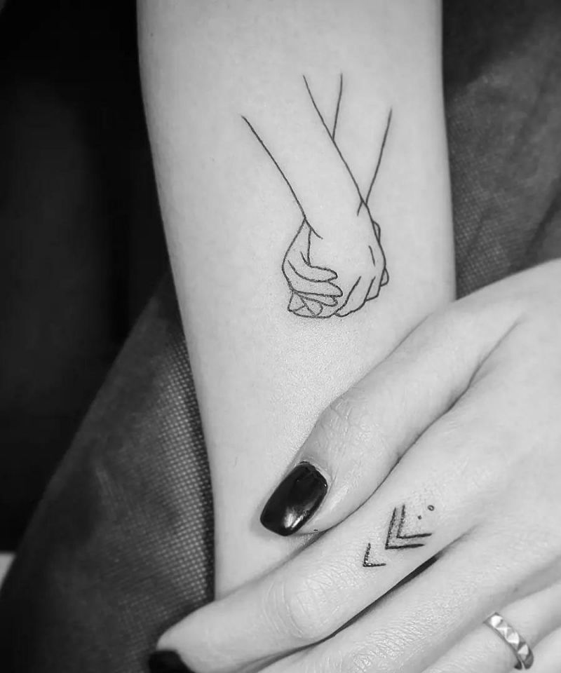 30 Great Holding Hands Tattoos You Will Love