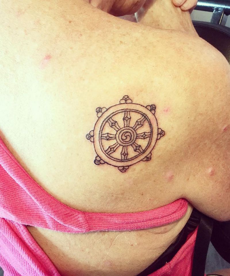 30 Awesome Dharma Wheel Tattoos to Inspire You