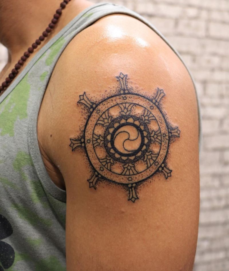 30 Awesome Dharma Wheel Tattoos to Inspire You