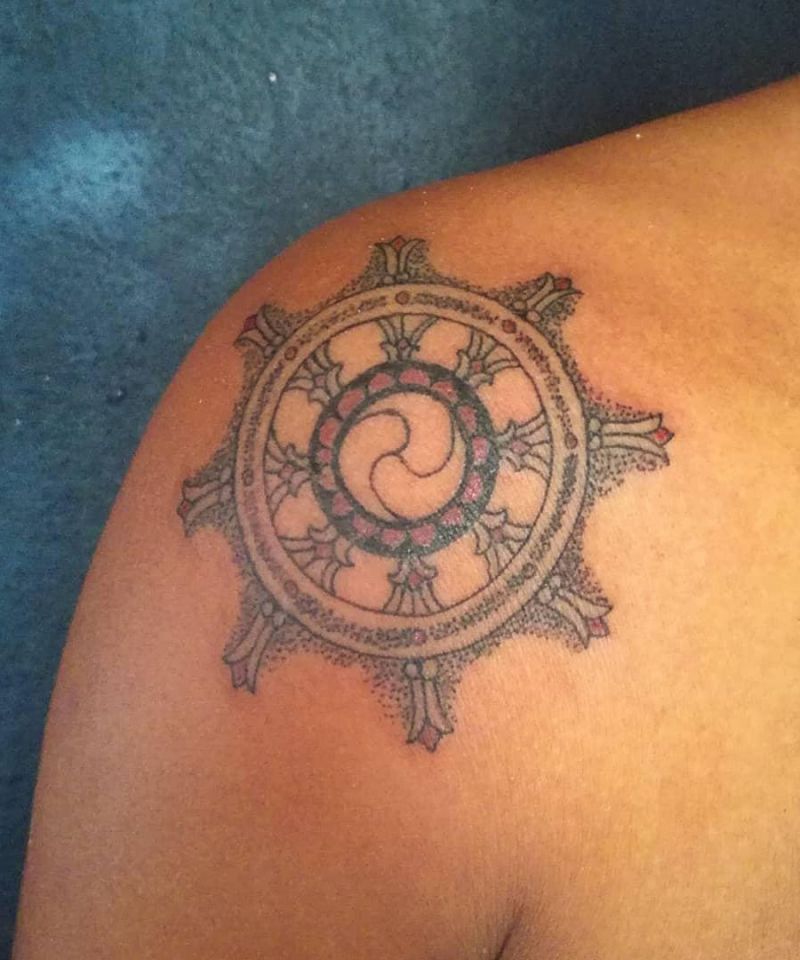 30 Awesome Dharma Wheel Tattoos to Inspire You