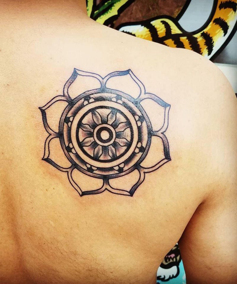 30 Awesome Dharma Wheel Tattoos to Inspire You