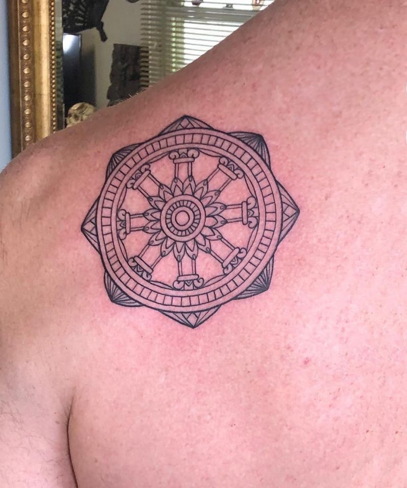 30 Awesome Dharma Wheel Tattoos to Inspire You