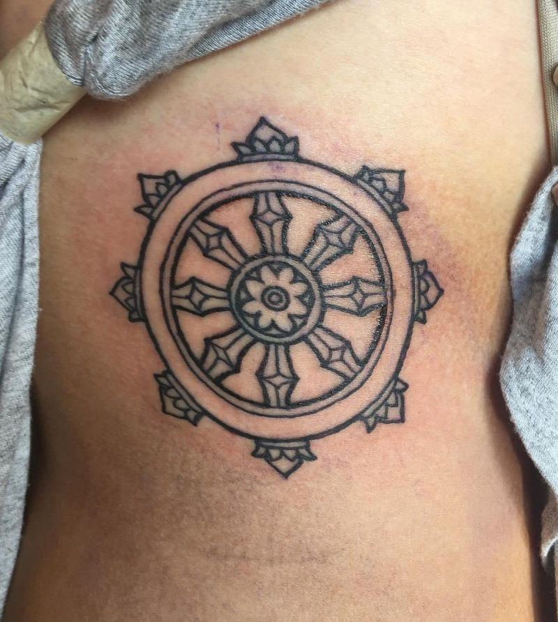 30 Awesome Dharma Wheel Tattoos to Inspire You