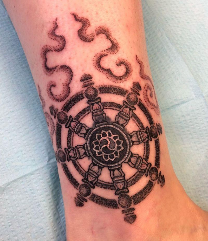 30 Awesome Dharma Wheel Tattoos to Inspire You