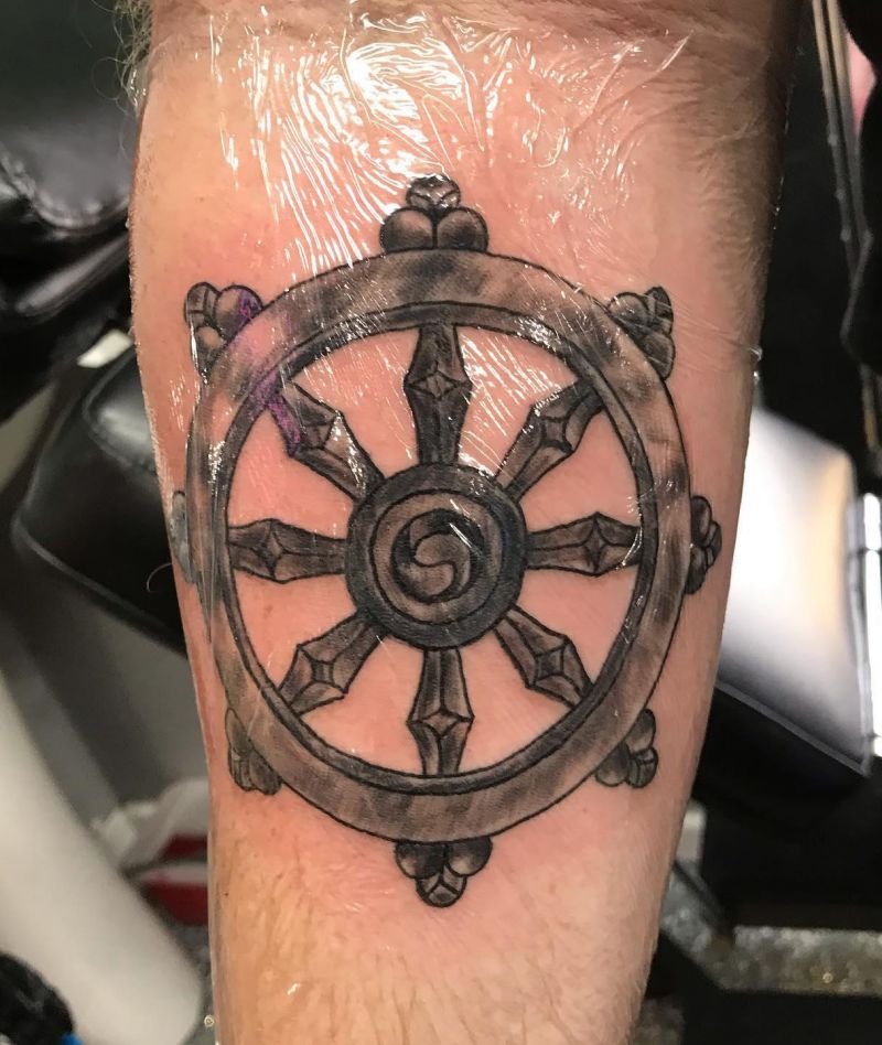 30 Awesome Dharma Wheel Tattoos to Inspire You