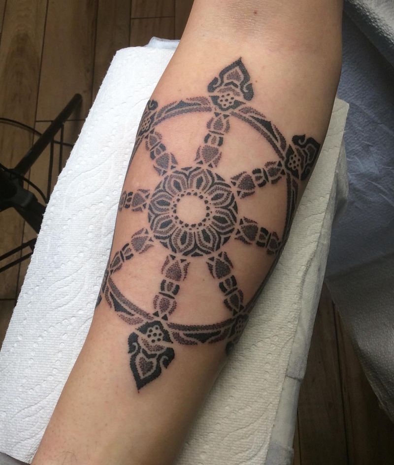 30 Awesome Dharma Wheel Tattoos to Inspire You