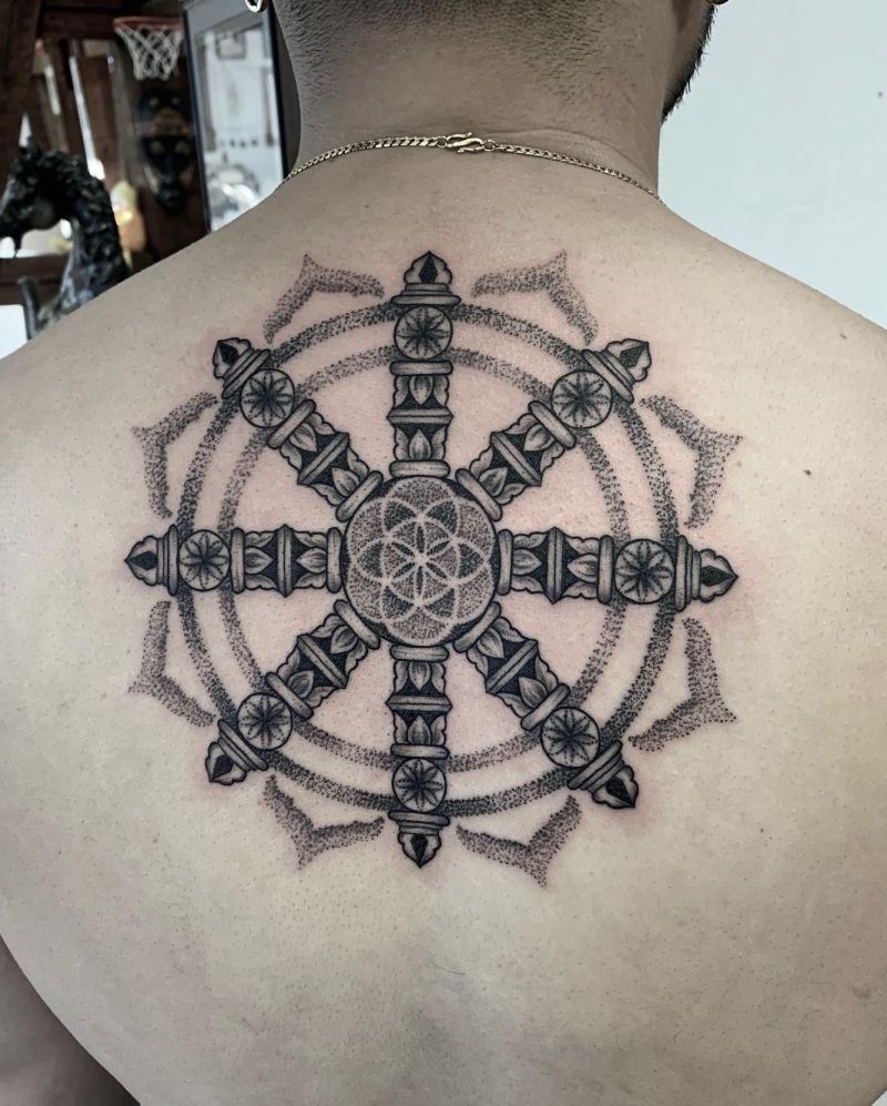 30 Awesome Dharma Wheel Tattoos to Inspire You