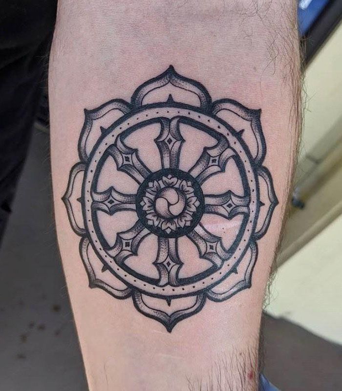 30 Awesome Dharma Wheel Tattoos to Inspire You
