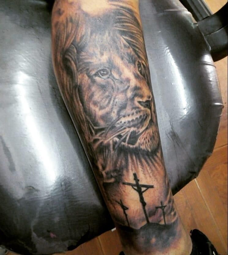 30 Unique Lion Cross Tattoos You Can Copy