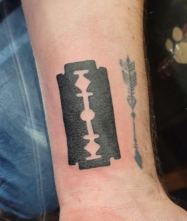 Black Razor Blade Tattoo on Arm