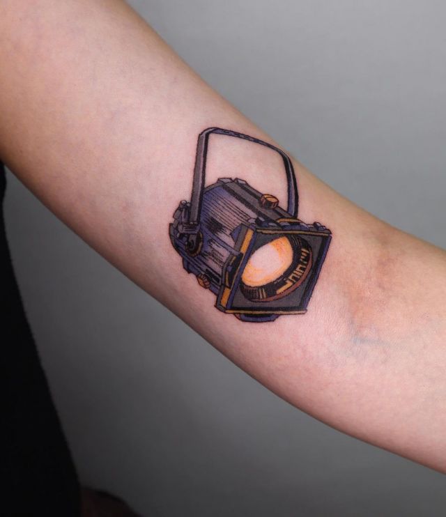 Pretty Spotlight Tattoo on Arm