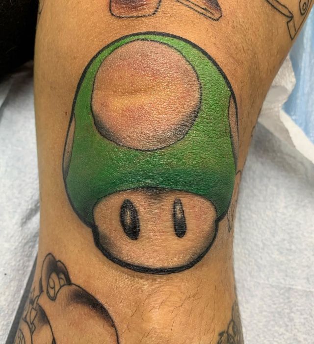 Green Mario Mushroom Tattoo on Leg