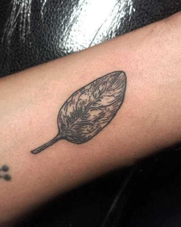 Black Spinach leaf Tattoo on Arm