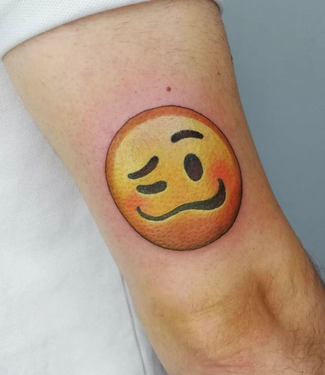 Yellow Emoji Tattoo on Arm