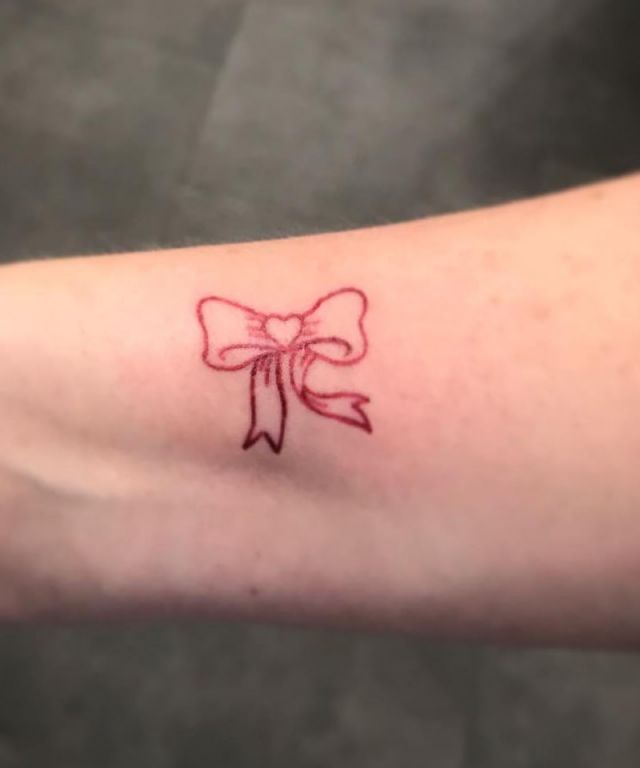 Small Red Bow Tie Tattoo on Arm