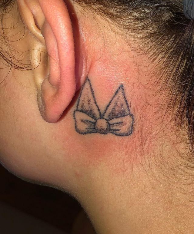 Small Bow Tie Tattoo Behind Ear