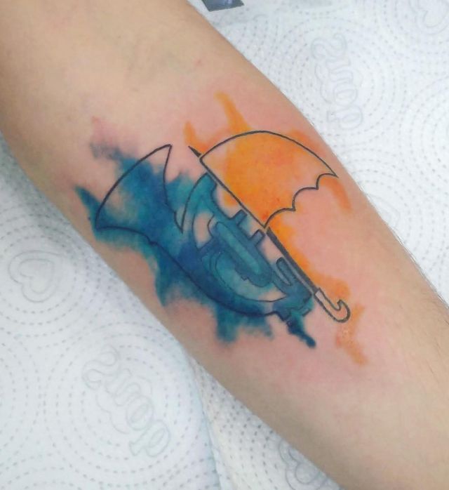Watercolor Blue French Trumpet and Yellow Umbrella Tattoo