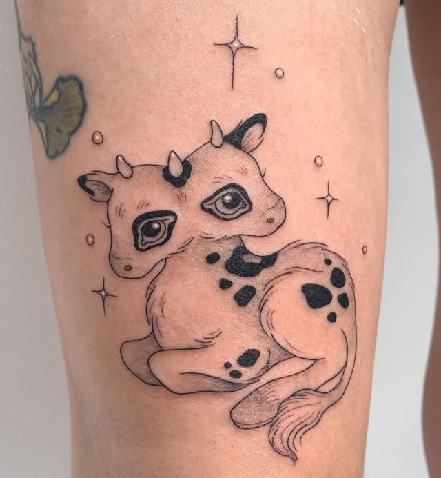 Cute Two Headed Calf Tattoo On Leg