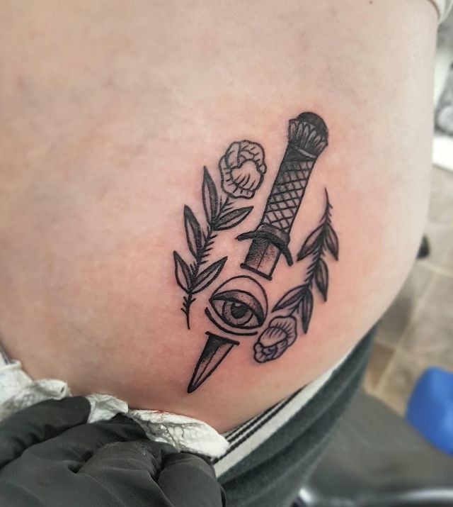 Dagger Eye Tattoo with Flowers on Stomach