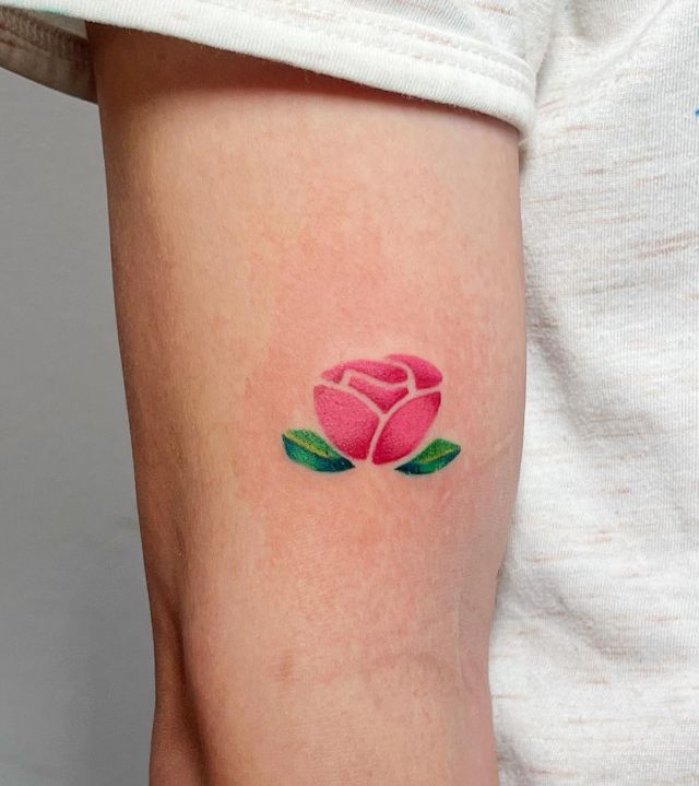 Elegant Small Pink Rose Tattoo on Arm