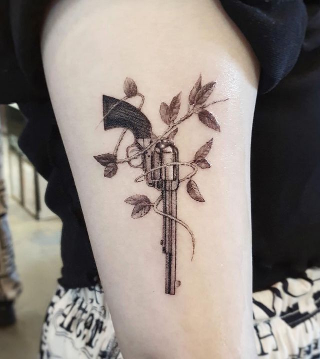 Revolver Tattoo with Vine on Upper arm