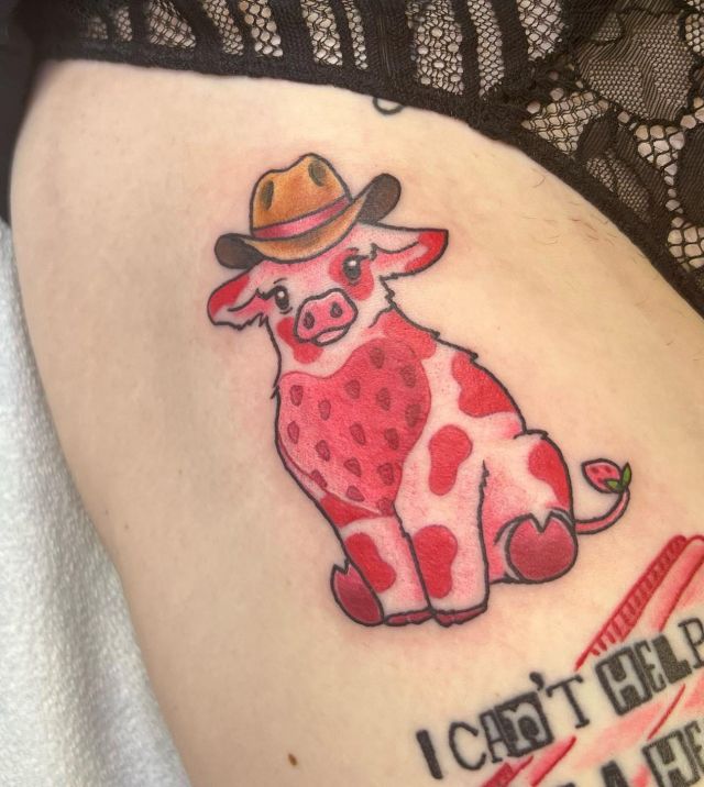 Elegant Strawberry Cow Tattoo on Thigh