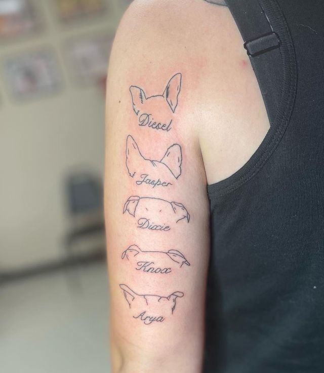 Dog Ear Tattoo with Name on Upper Arm