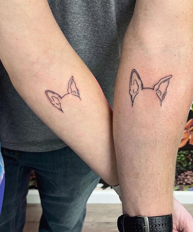 Pair Dog Ear Tattoo on Forearm