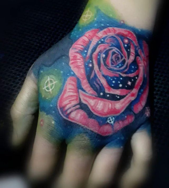 Delicate Space Rose Tattoo on Back of Hand