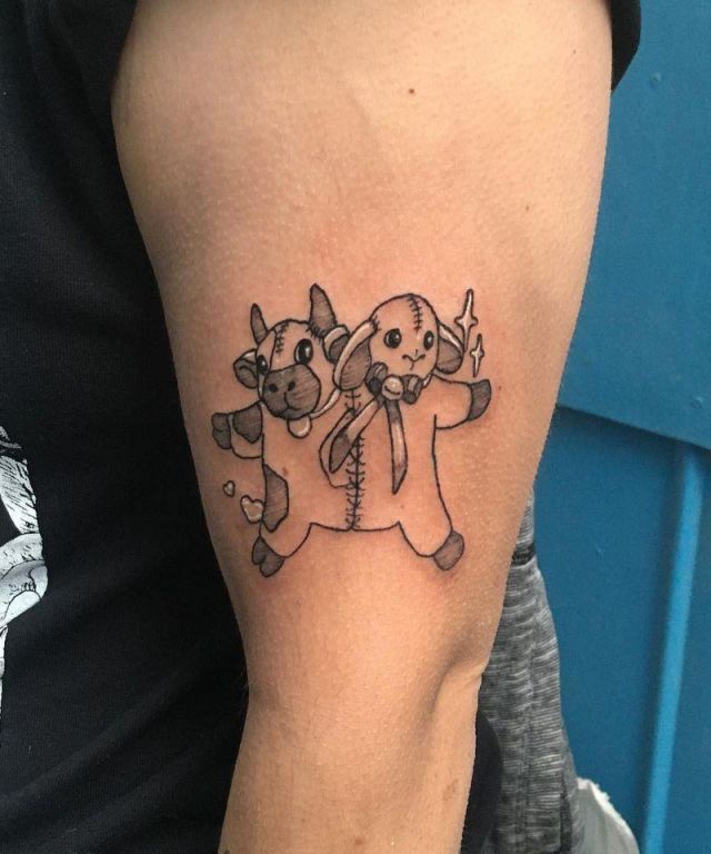 Calf Toy Tattoo on Arm
