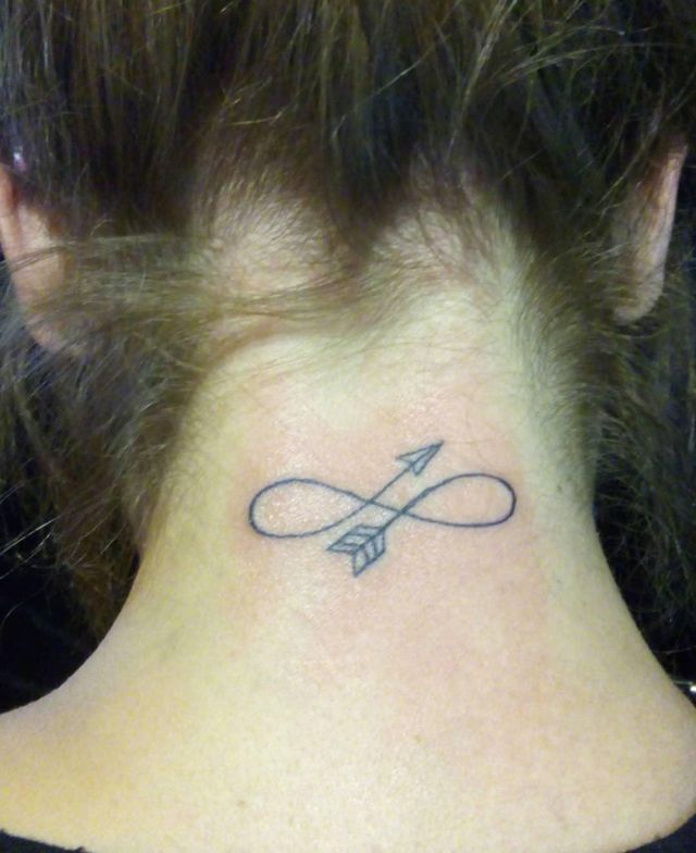Simple Malin Symbol Tattoo on the Back of the Neck