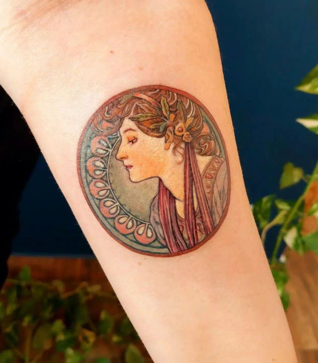 Round Alphonse Mucha Tattoo on Arm