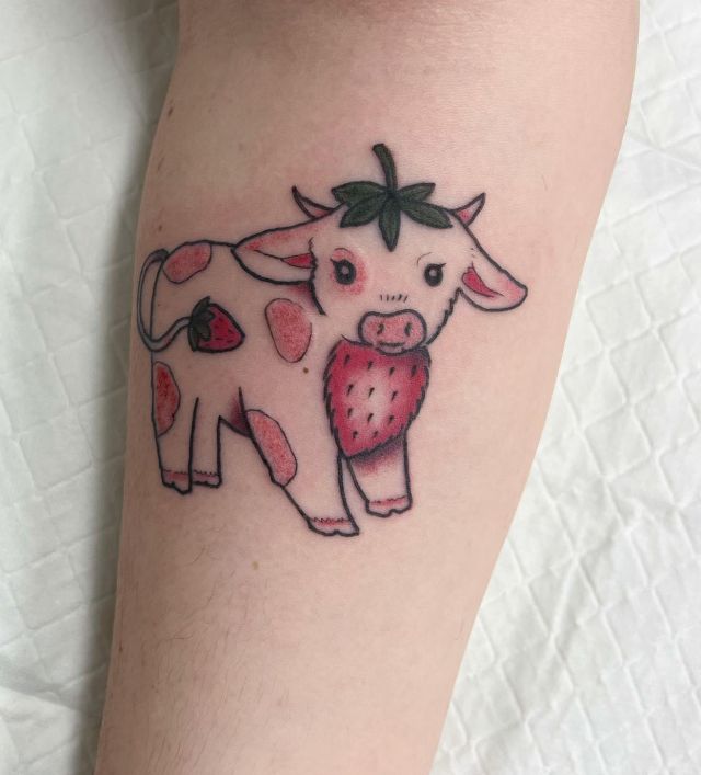 Unique Strawberry Cow Tattoo on Leg