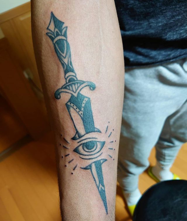 Black Dagger Eye Tattoo on Arm