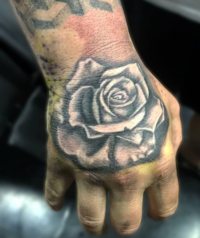 Unique White Rose Tattoo on Back of Hand