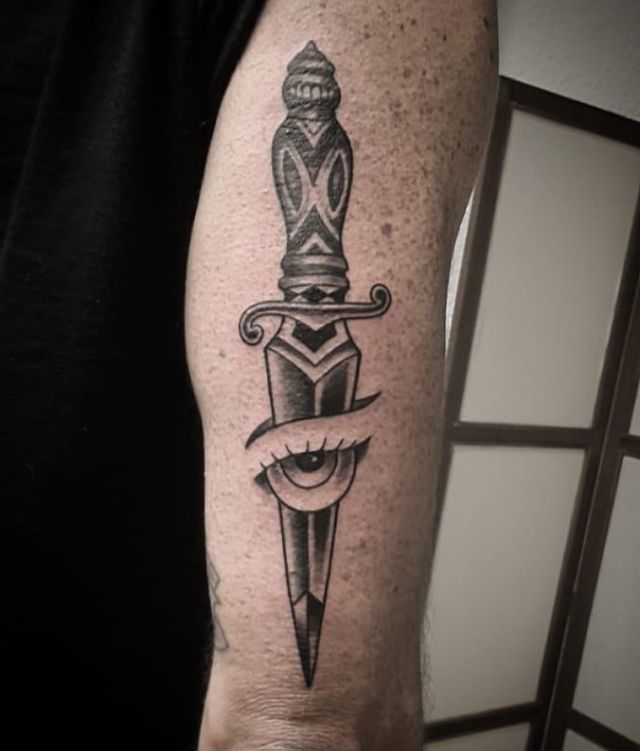 Unique Dagger Eye Tattoo on Upper Arm