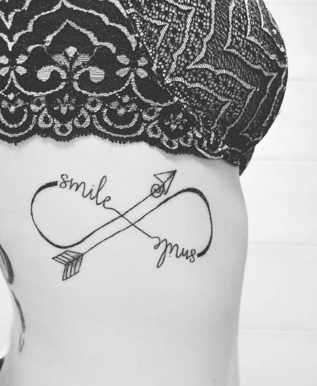 Unique Malin Symbol Tattoo on Belly