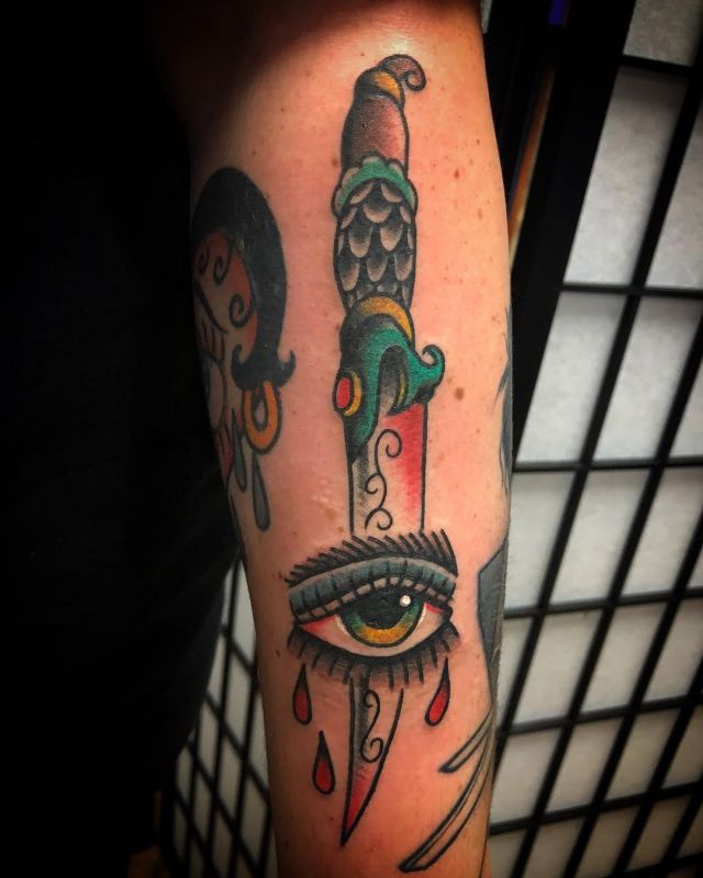 Colored Dagger Eye Tattoo on Upper Arm