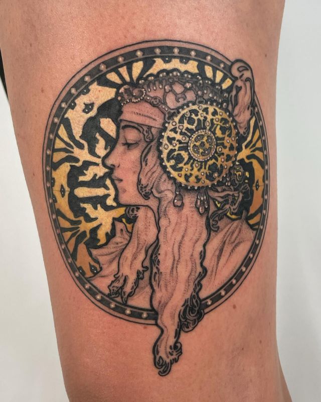 Round Alphonse Mucha Tattoo on Leg