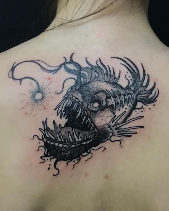 Black Angler Fish Tattoo on Back